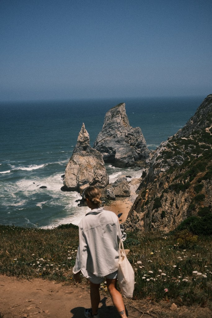Girl walking by the cliffs in Cabo da Roca