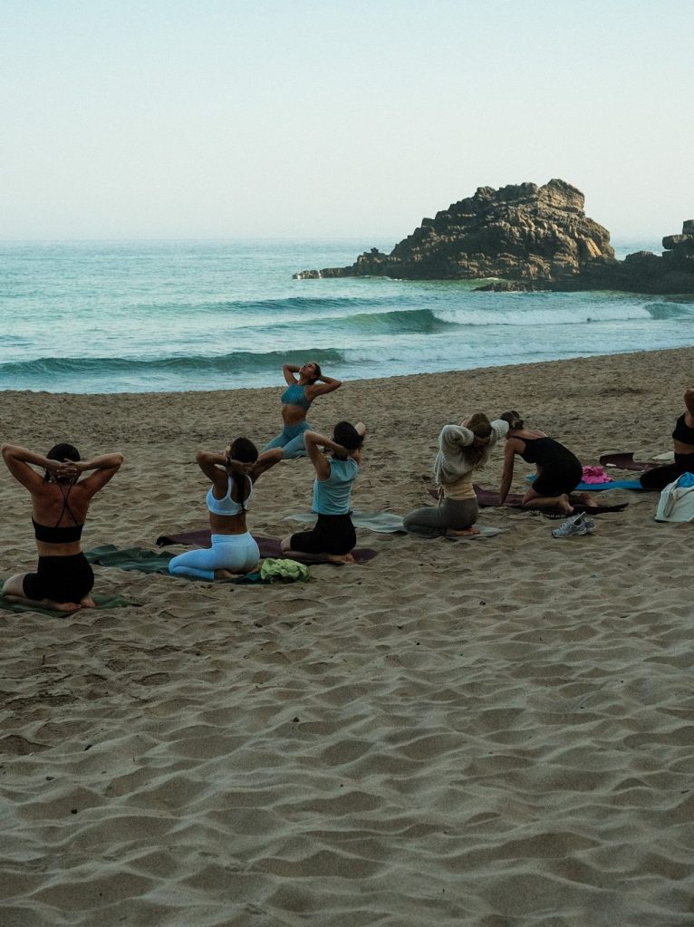 Yoga on the beach at sunrise